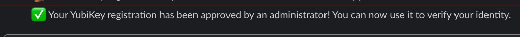 Bot DM confirming YubiKey registration was approved by an administrator